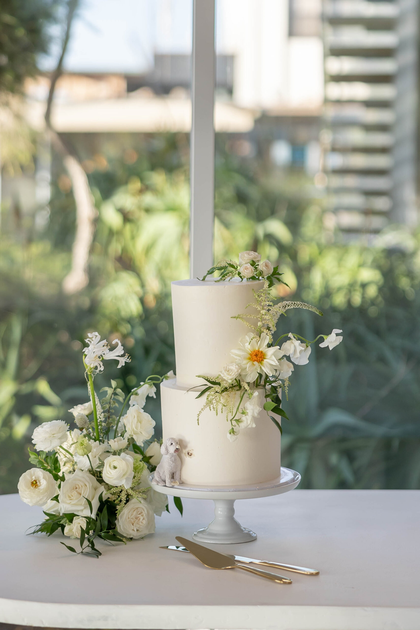 Elegant tablescape with candles, white linens, and Crown Rentals chairs
