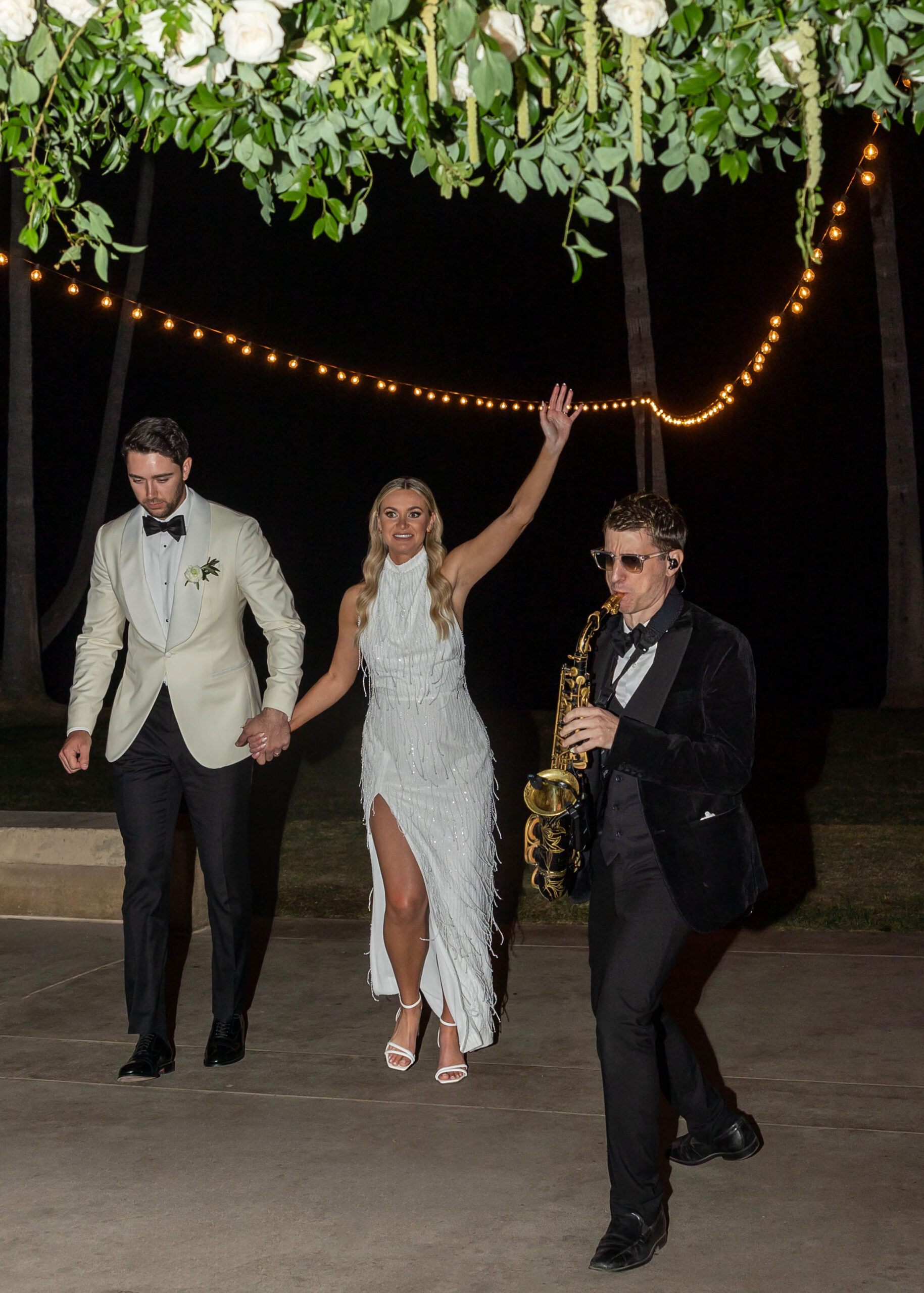 Bride’s second look with beaded party dress and saxophone grand entrance