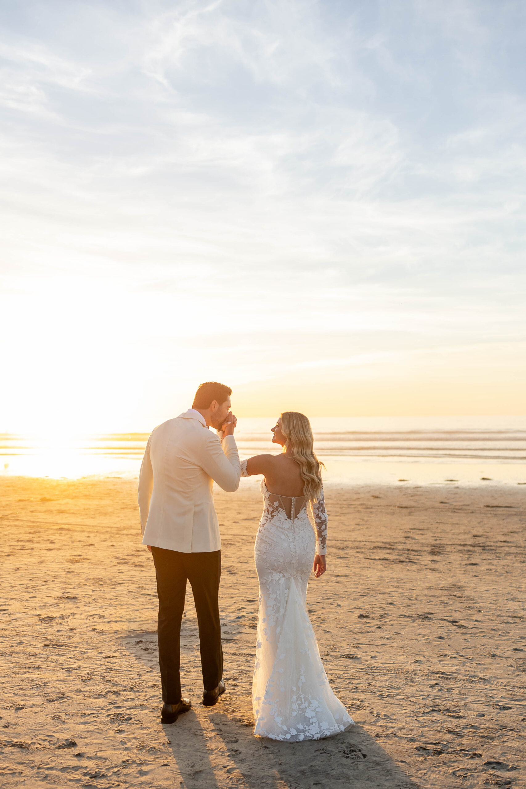 Bride and groom portraits on the beach with soft winter light