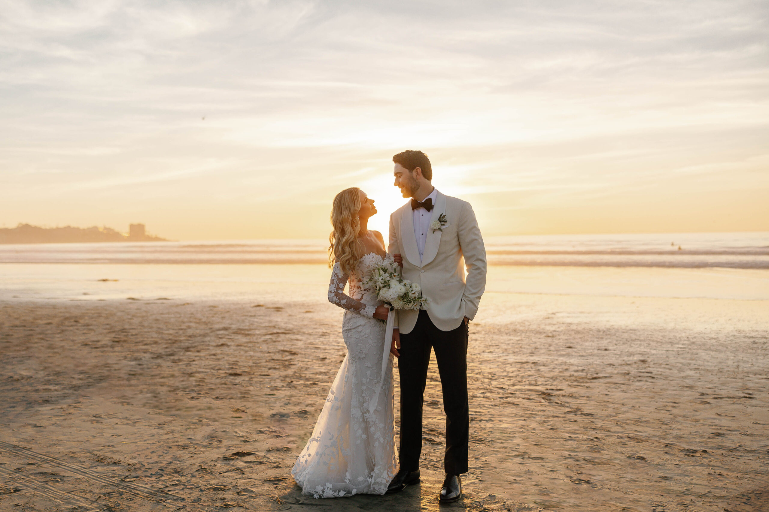 Bride and groom portraits on the beach with soft winter light