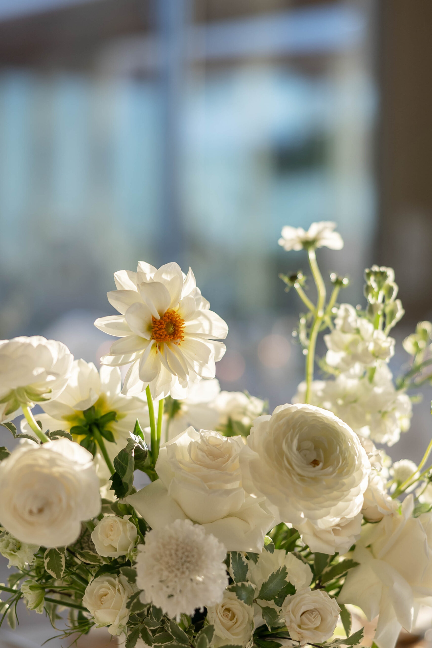 Elegant tablescape with candles, white linens, and Crown Rentals chairs