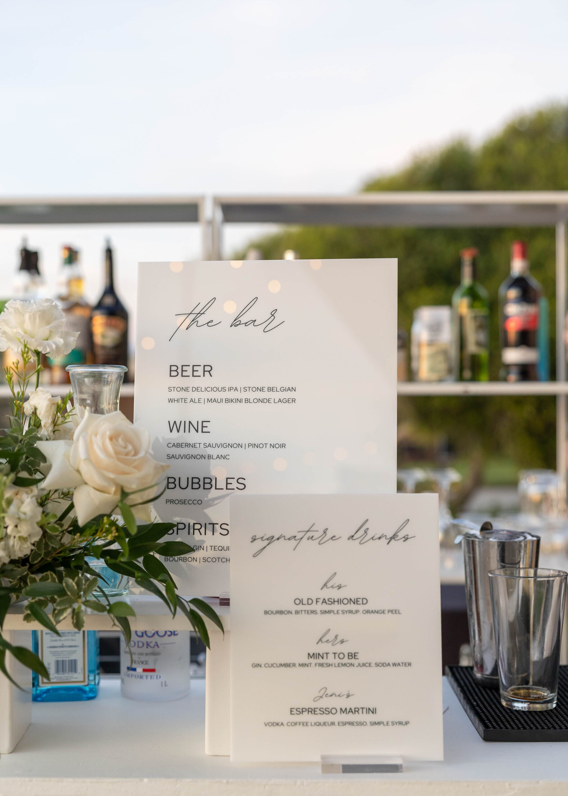 Elegant tablescape with candles, white linens, and Crown Rentals chairs