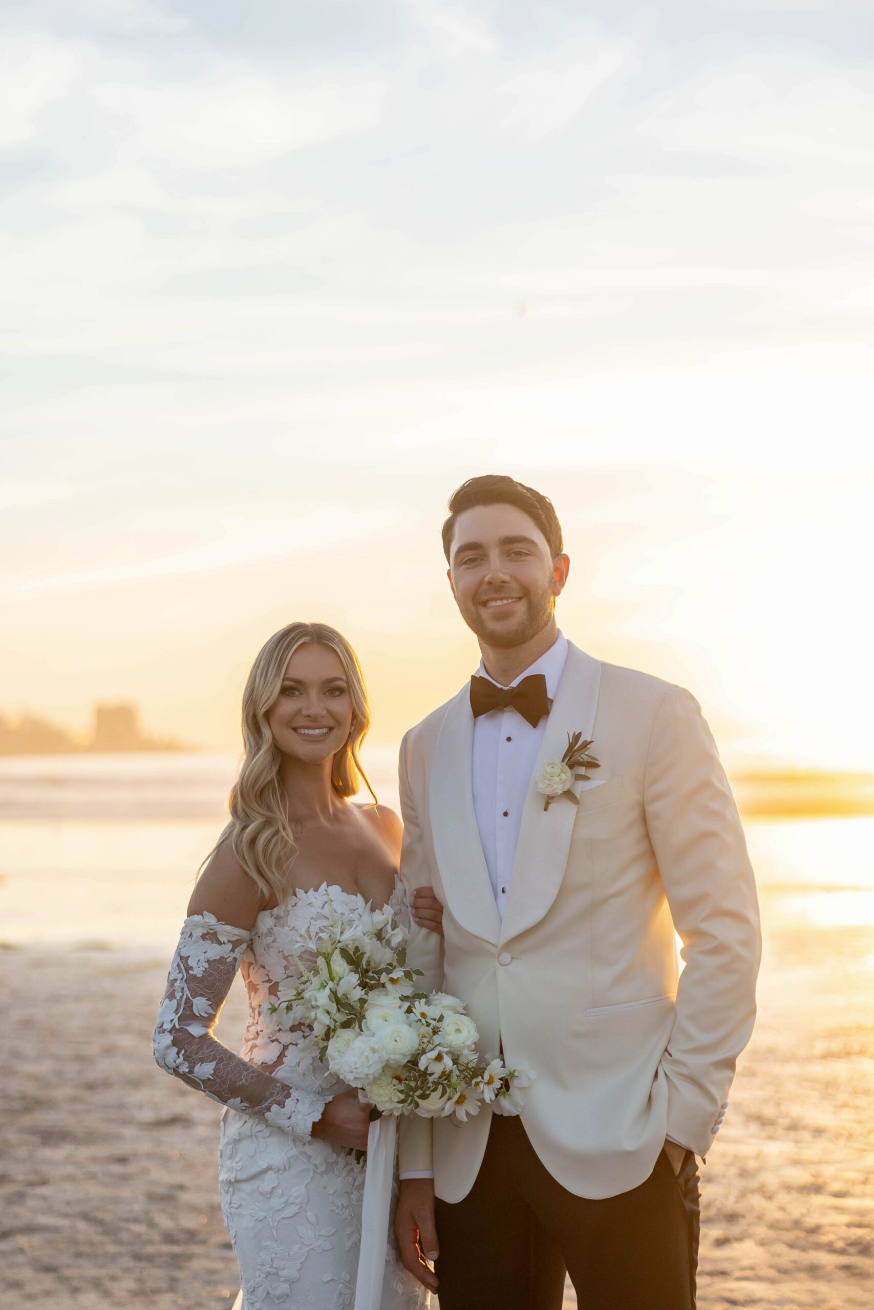 Bride and groom portraits on the beach with soft winter light