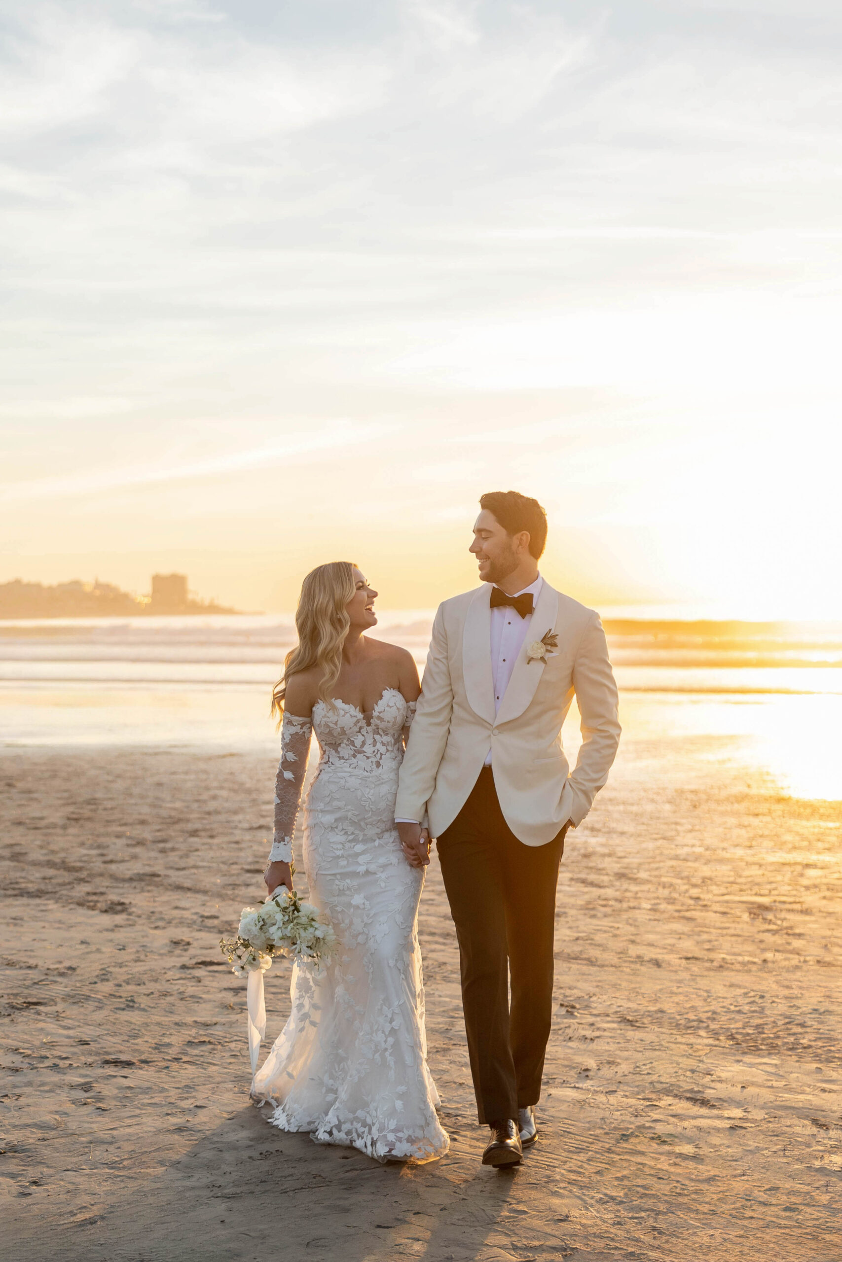 Bride and groom portraits on the beach with soft winter light