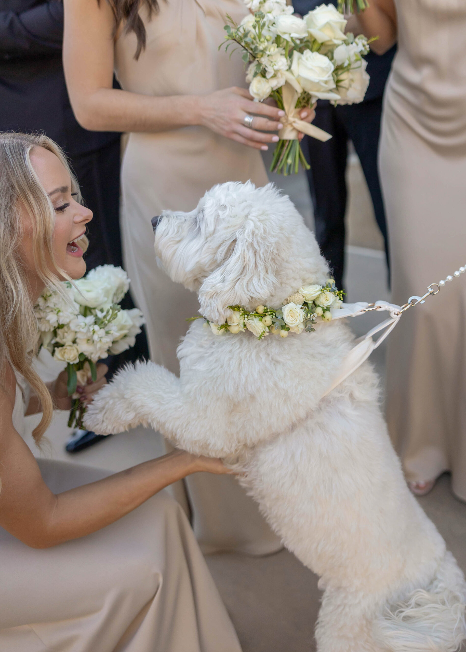 Modern wedding portraits with ocean backdrop and classic florals