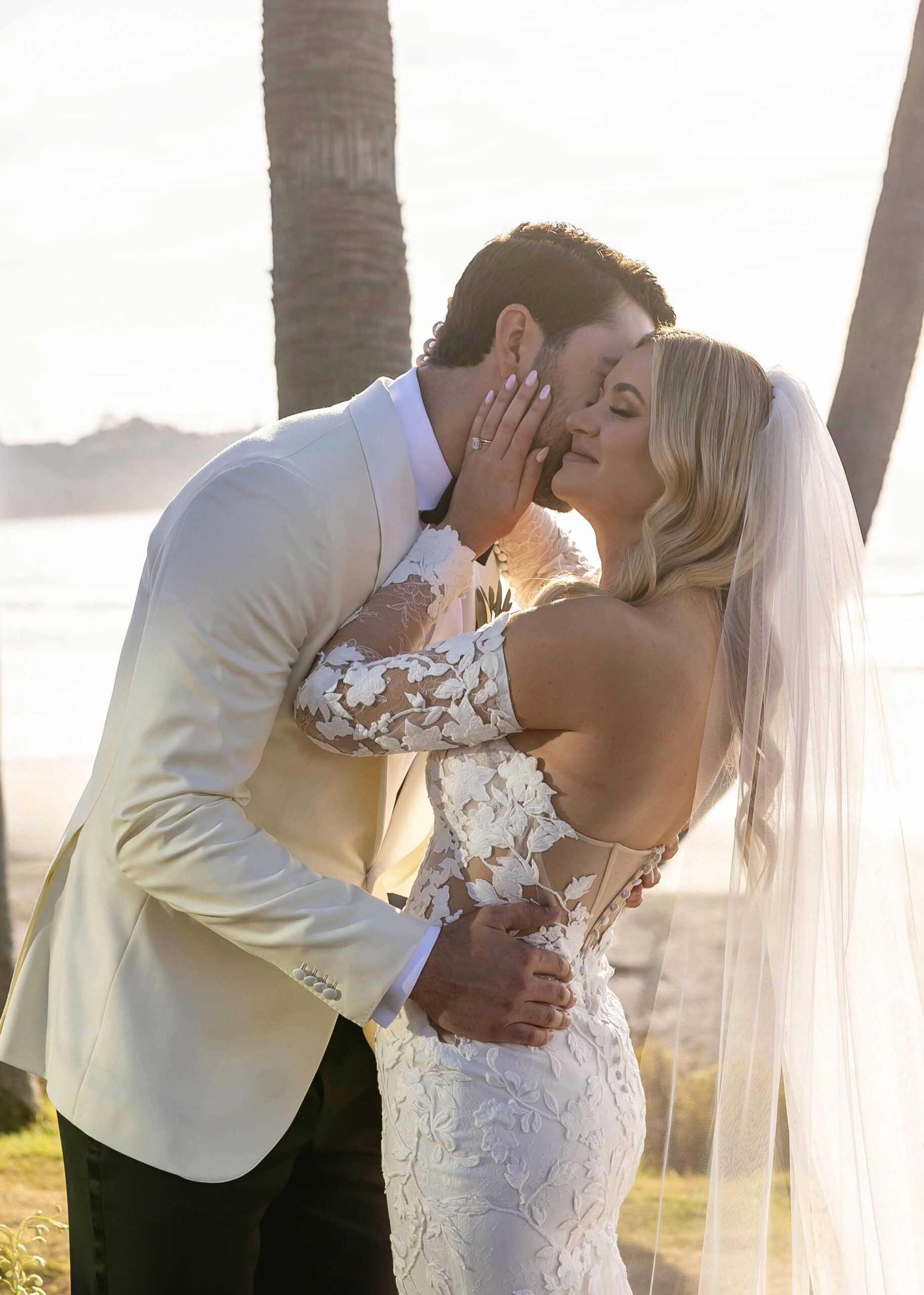 Romantic vows with coastal view and candle-lined aisle
