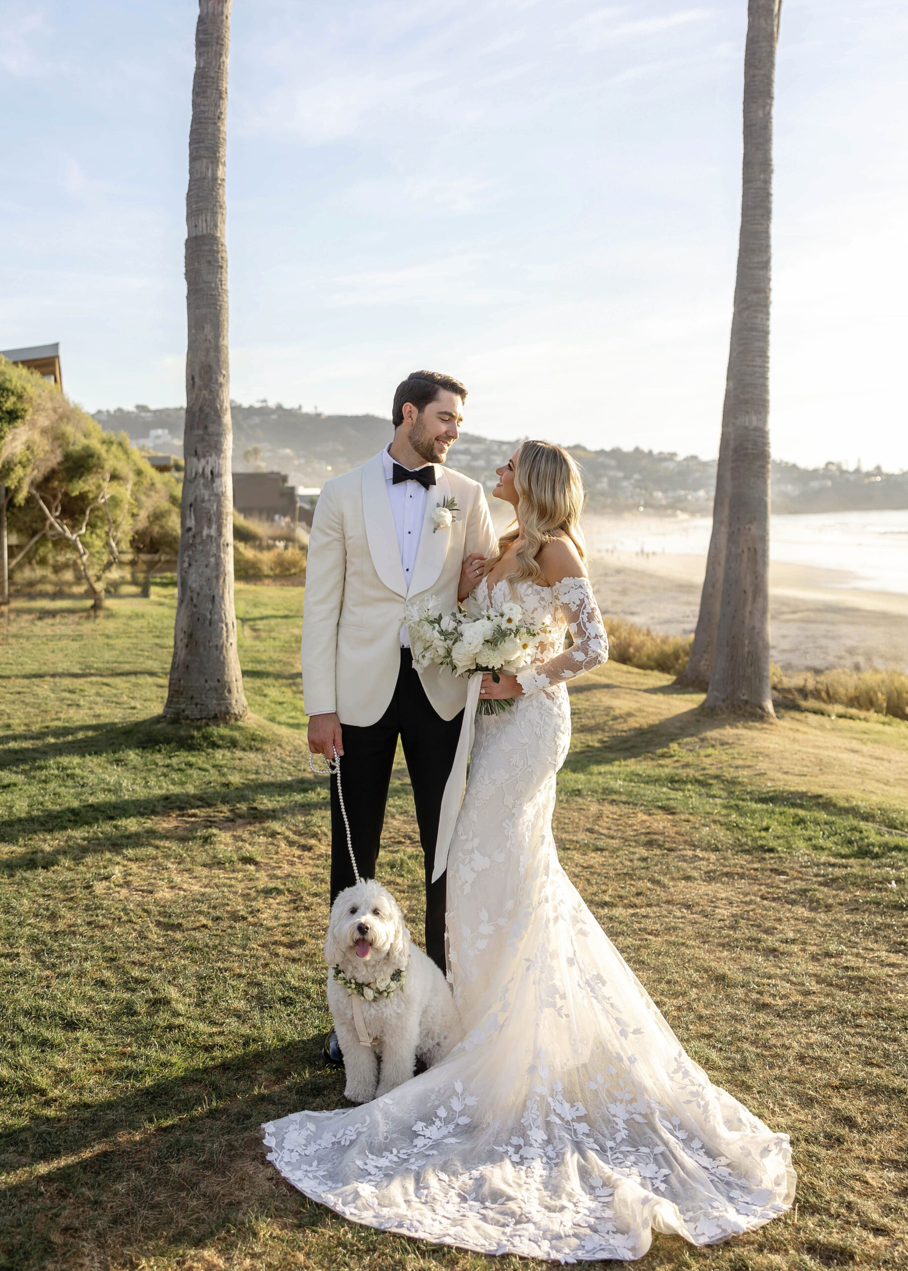 Bride and groom walking down the aisle with their dog at La Jolla wedding